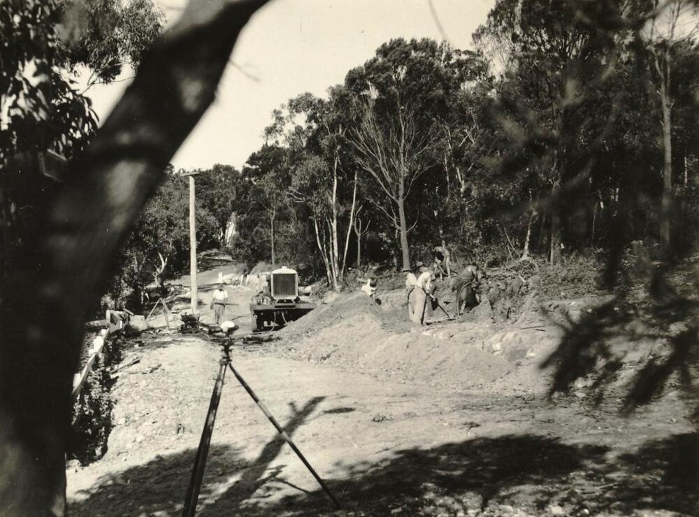 Construction continues on Callicoma Road, Seaforth, September 1956