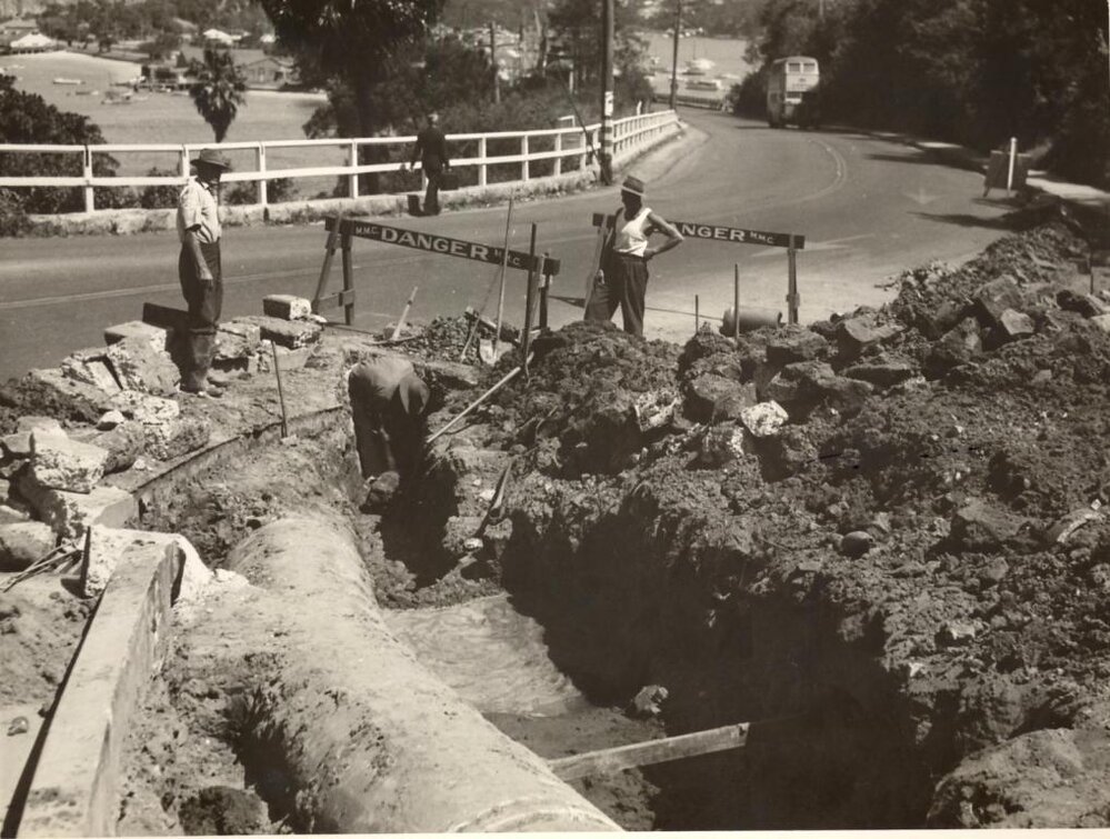 Earthworks continue with placement of a 30-inch pipe at Battle Boulevarde, Seaforth, October 1948