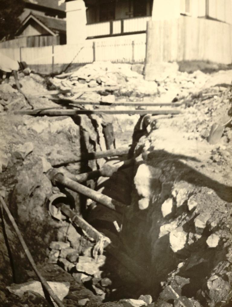 Pipe laying in Kangaroo Street, corner Birkley Road, Manly, c1940s