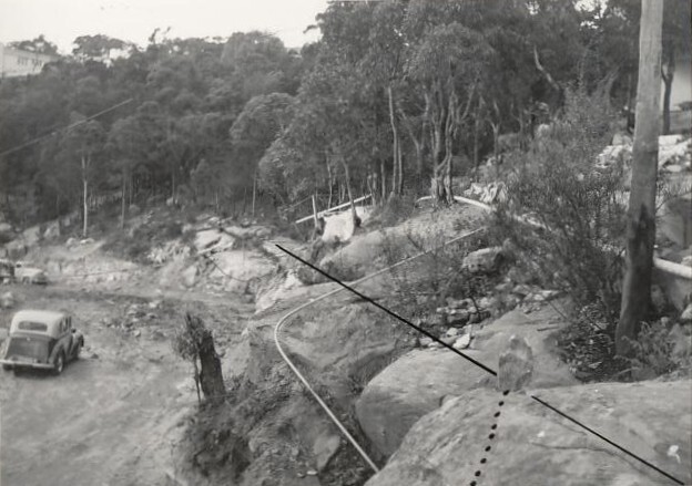 Peronne Avenue, rocky hillside and vehicle, Clontarf, 1956