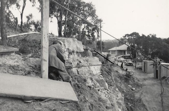 Peronne Avenue construction works contnue, man on hillside, Clontarf, 1956
