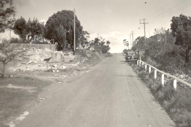 Woodland Street, view up slope, with parked car, Balgowlah Heights, c1940s