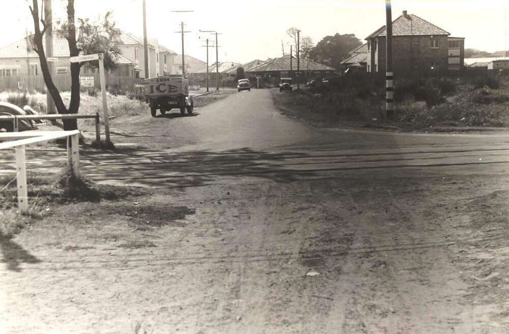 Unidentified street intersection with ice truck, number 5134, c1940s