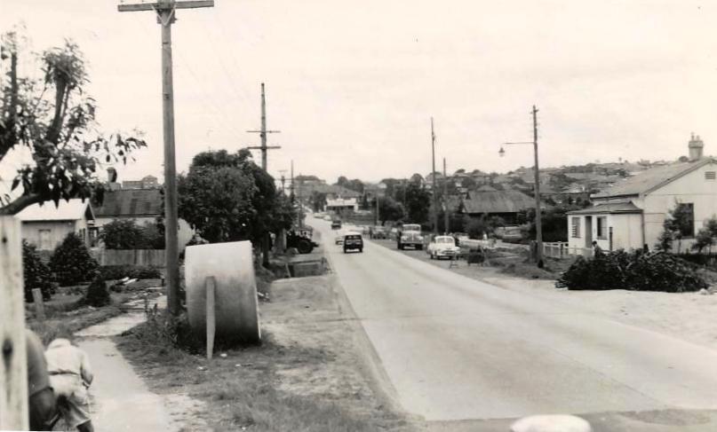 Unidentified suburban street cars and houses, c1940s
