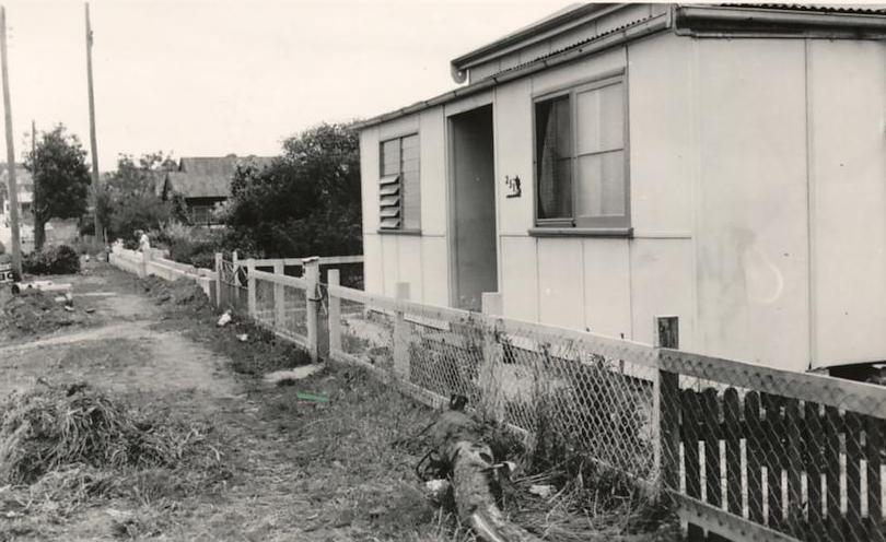 Nature strip in front of cottage on unidentified street, c1940s