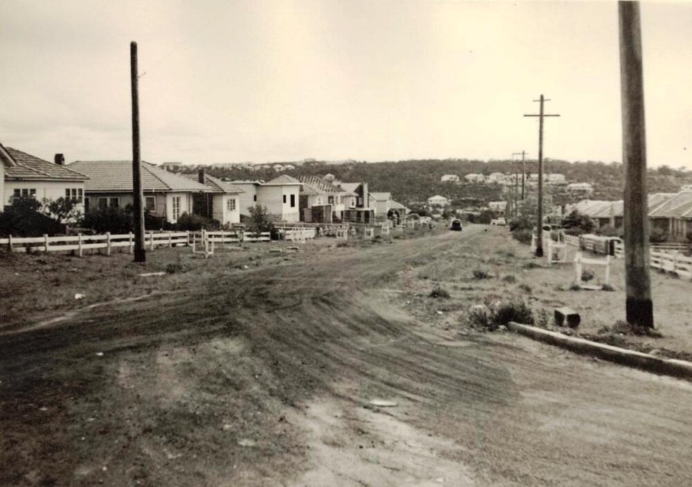Construction continues on an unidentified unsealed road, c1940s
