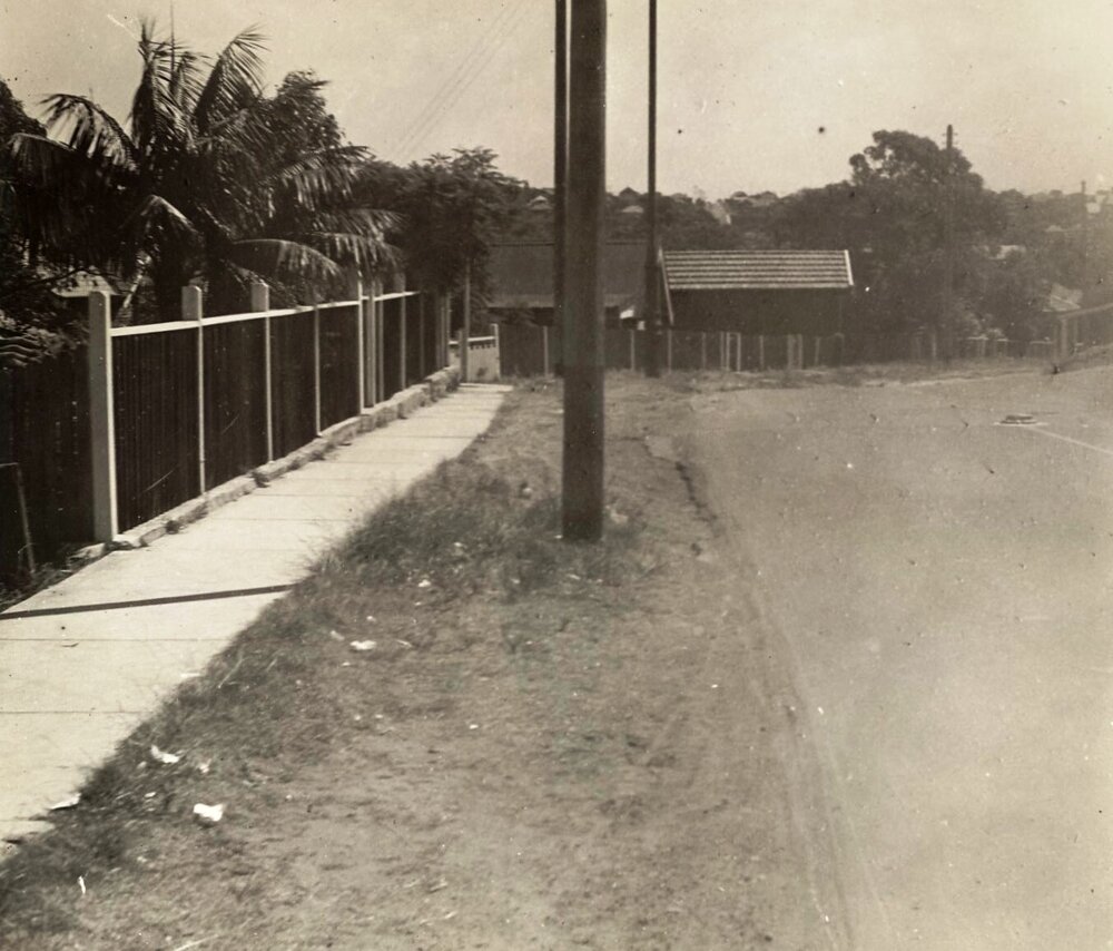 Unidentified street view with traffic dome and footpath, c1940s