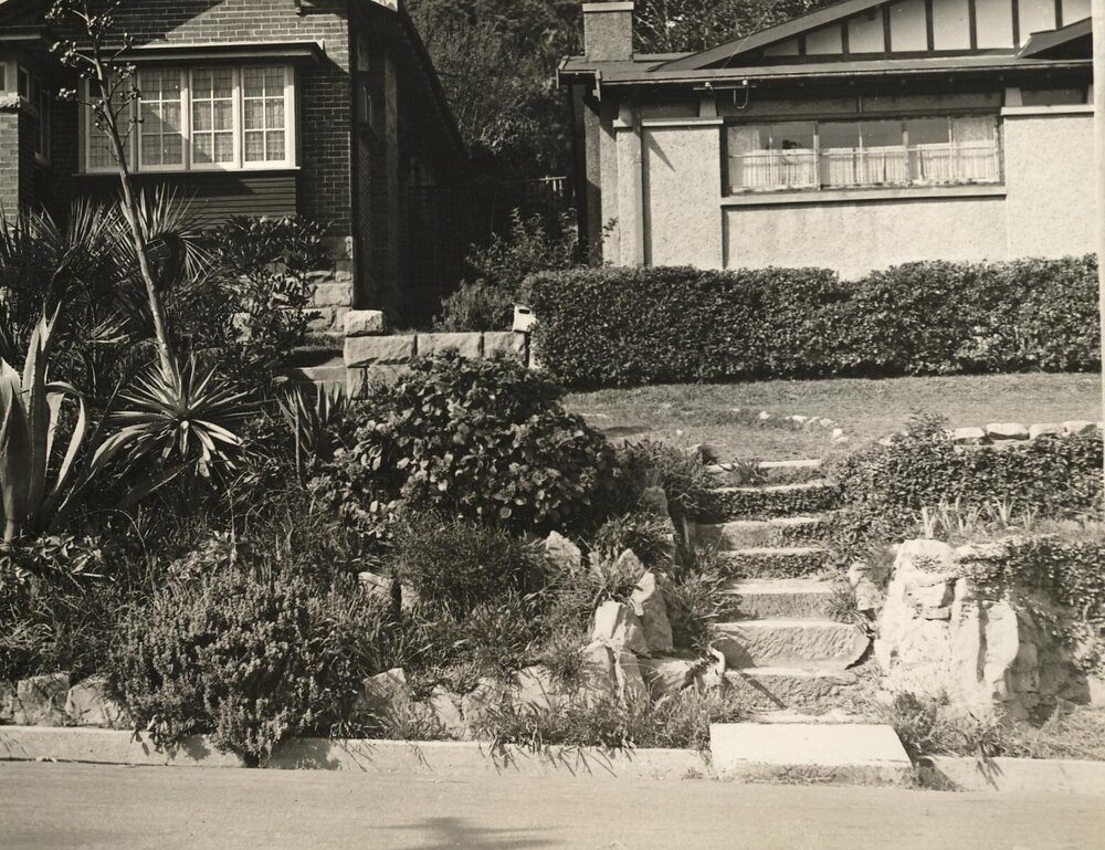 Front garden beds between two houses, c1940s
