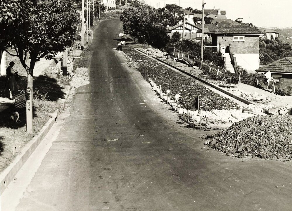 Roadworks continue on unidentified residential street, c1940s
