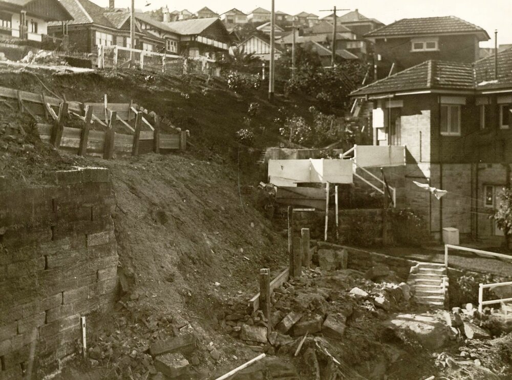 Earthworks continue on steep slope of unidentified site, c1940s