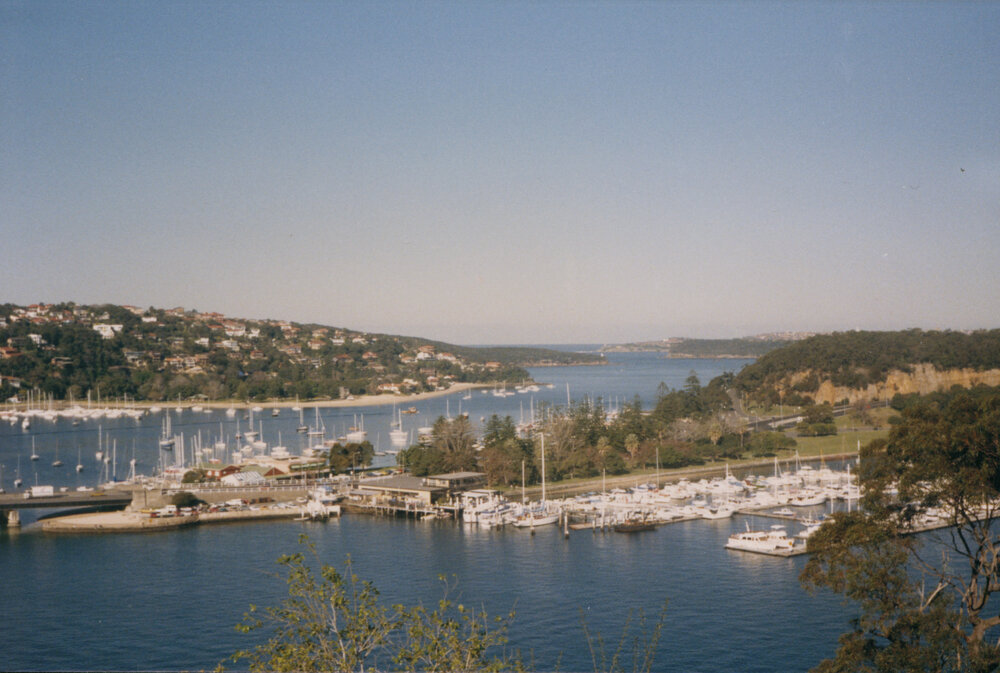 View of the approaches to the Spit Bridge showing explosives wharf left side of the marina shop, 1988