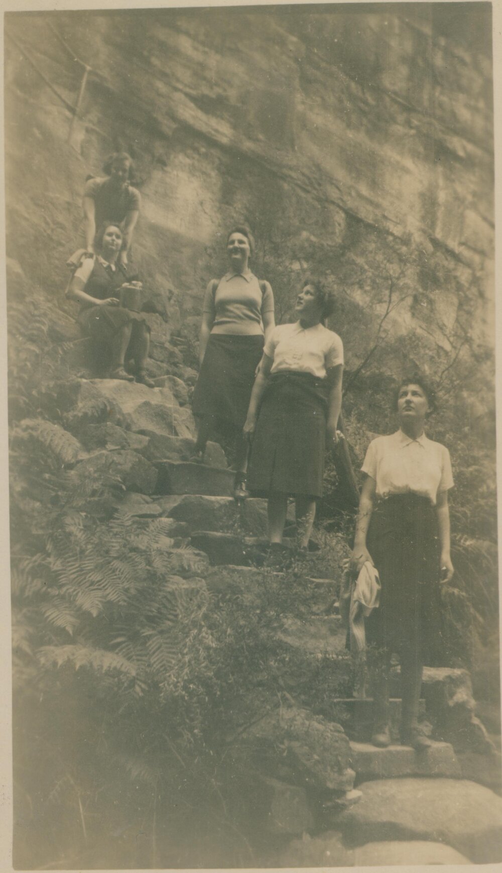 Five women standing on stairs, Narrabeen, 1943