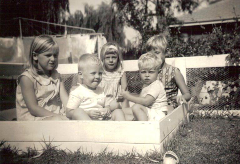 Baird children in their sand pit at 18 St Andrews Gate, Elanora Heights, 1965