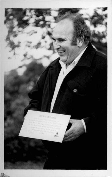 Descendent of George and Mary Mulhall Holding Plaque, Palm Beach, 1992