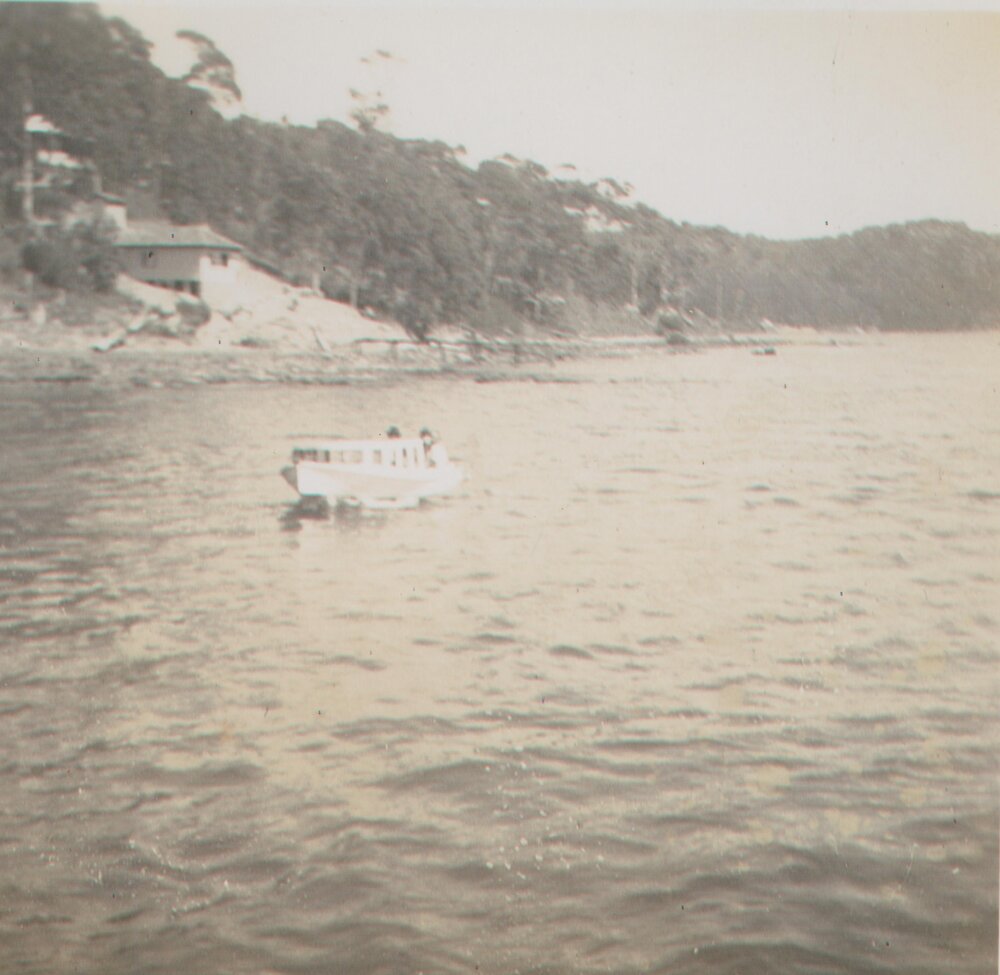 Gill Boat motoring off from the wharf, Scotland Island