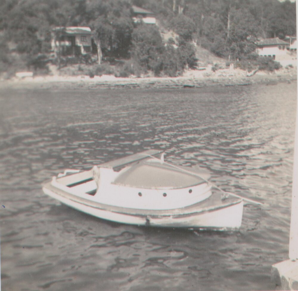 Small boat docked at wharf, Scotland Island, c1960