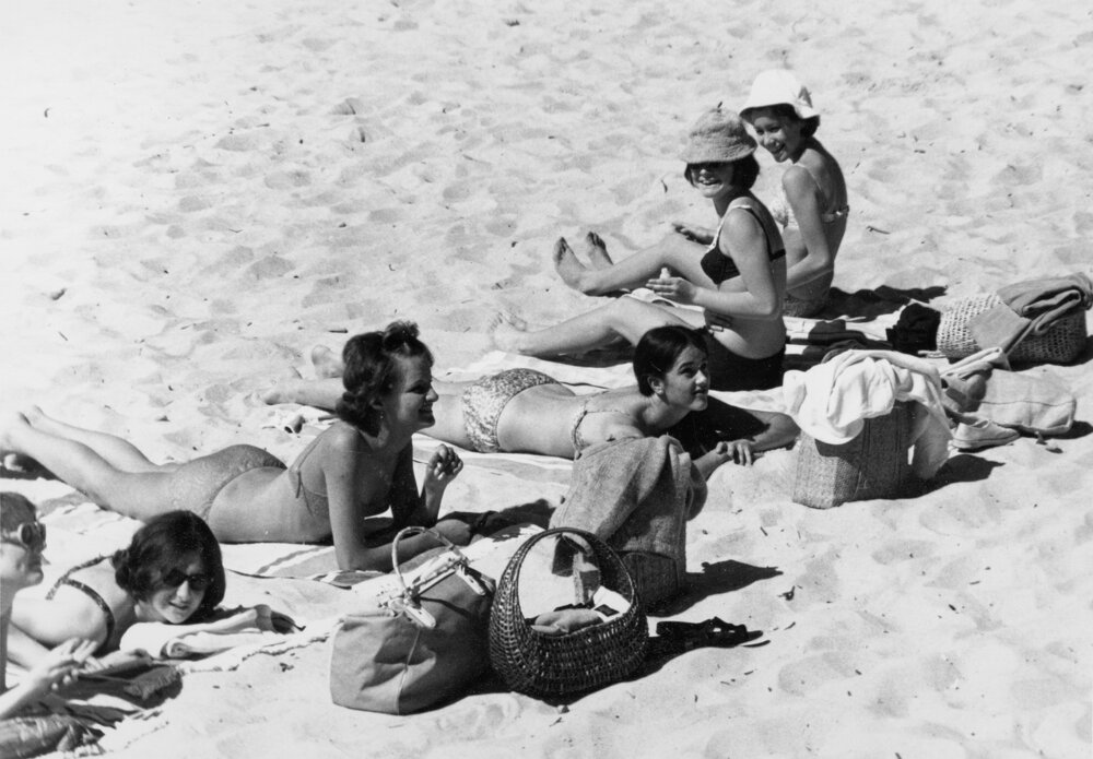 Group of women sunbathing at Manly Beach, Manly, c1967-1973