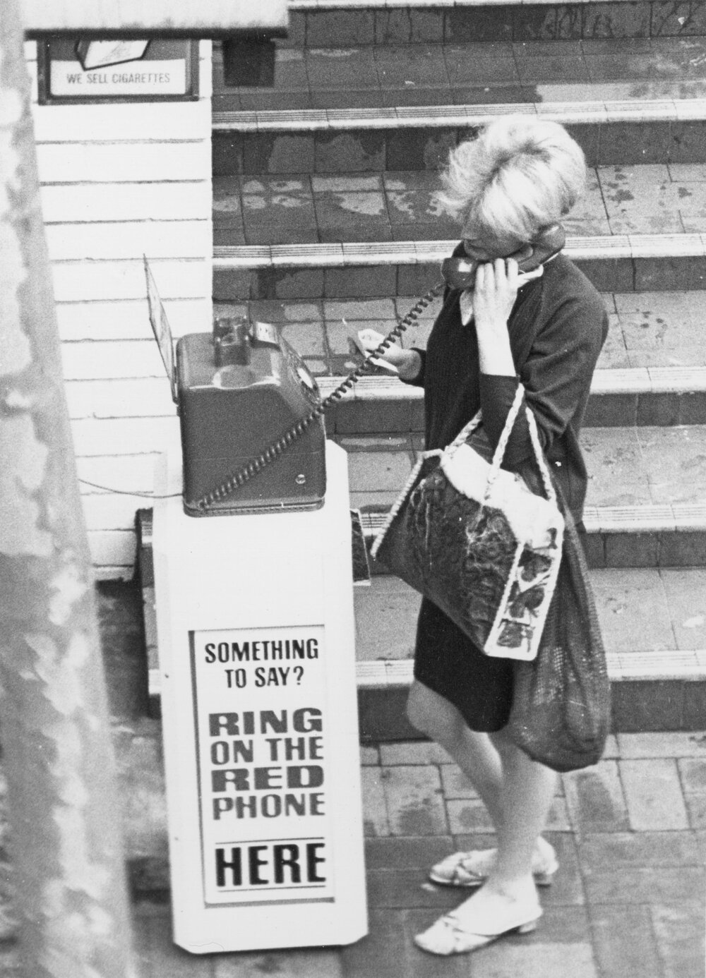 Lady making a call on a public Red Phone, Manly, c1967-1973