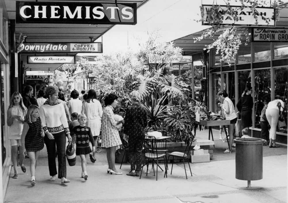 People walking through an arcade at Warringah Mall, Brookvale, c1967-1973