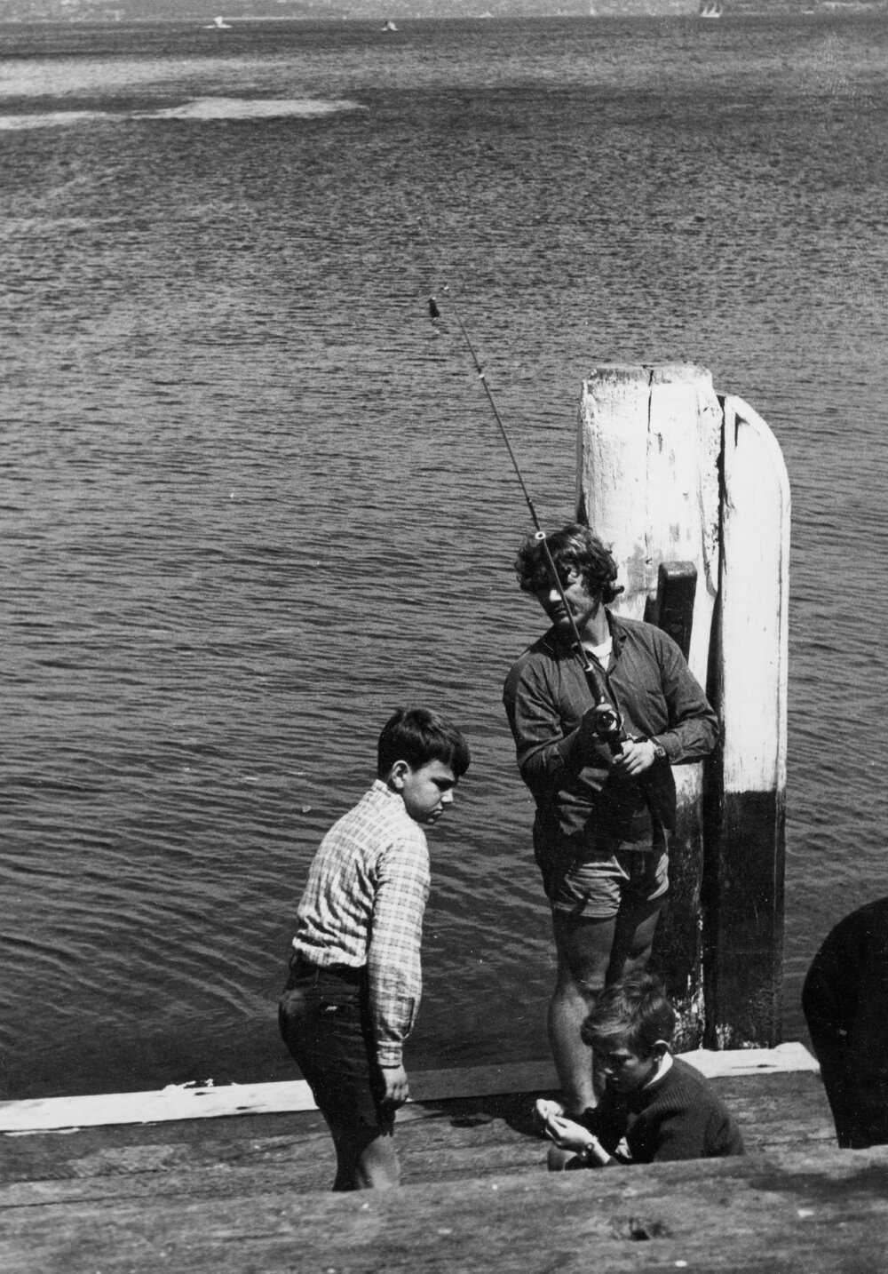 Man and two boys fishing at Manly Wharf, Manly, c1967-1973