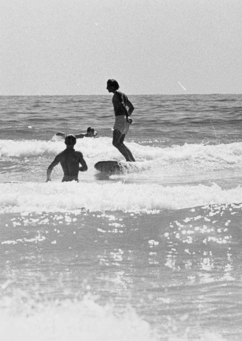 Surfers in the shallows at Manly Beach, Manly, 1972