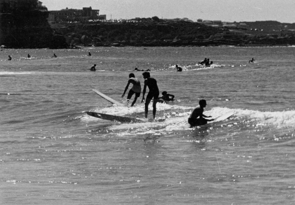 Surfing at Manly Beach with a view of Freshwater in the background, Manly, 1972