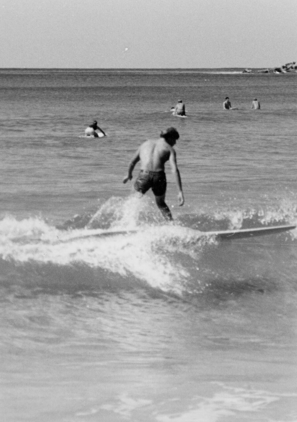 Surfer riding a wave at Manly Beach, Manly, 1972