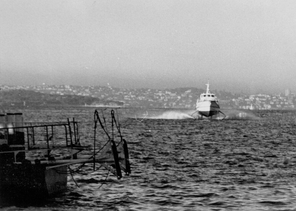 Fairlight  hydrofoil passing the harbour foreshore, Manly, c1967&ndash;1973
