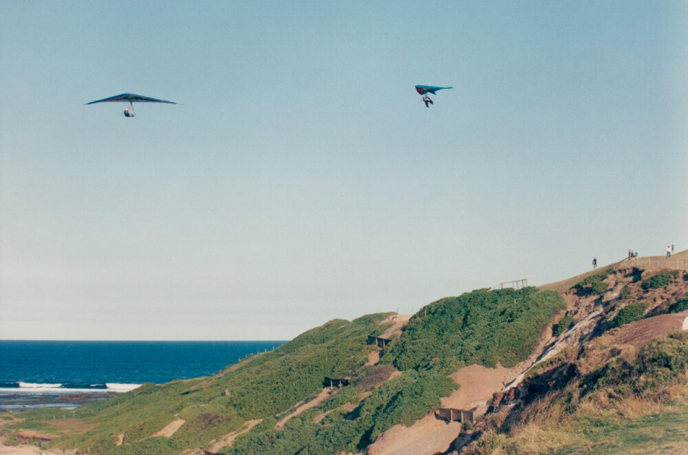 Hang gliders above coastal dunes near Long Reef golf course, Long Reef, 1992