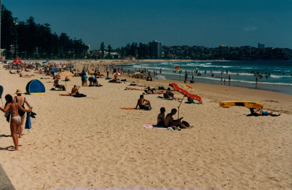 Beach activity along the shoreline at Manly Beach, Manly, 1997