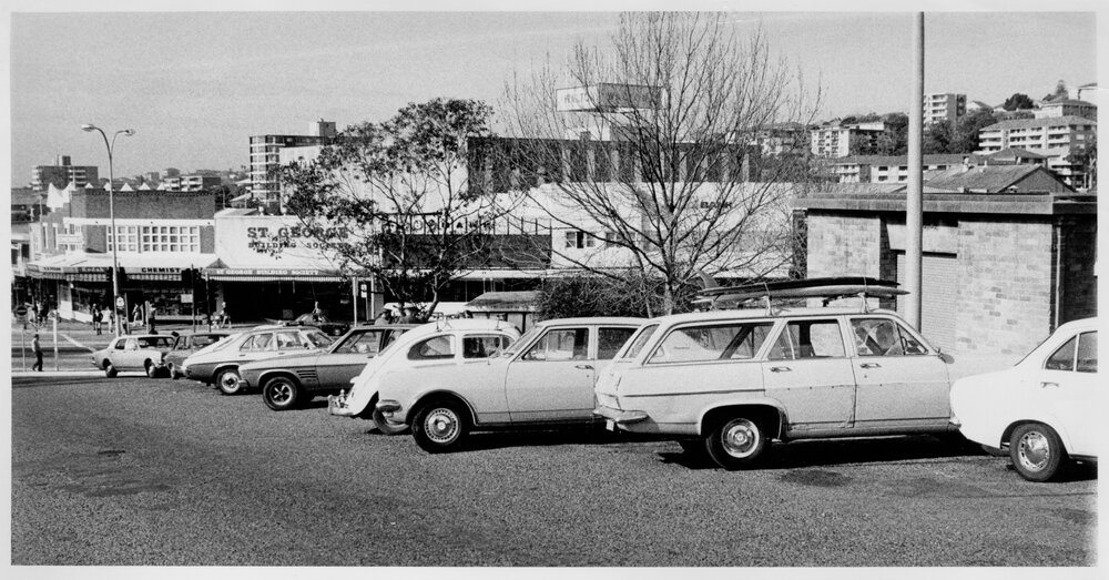 Looking east from the library carpark towards Pittwater Road and Howard Avenue, Dee Why, c1970s