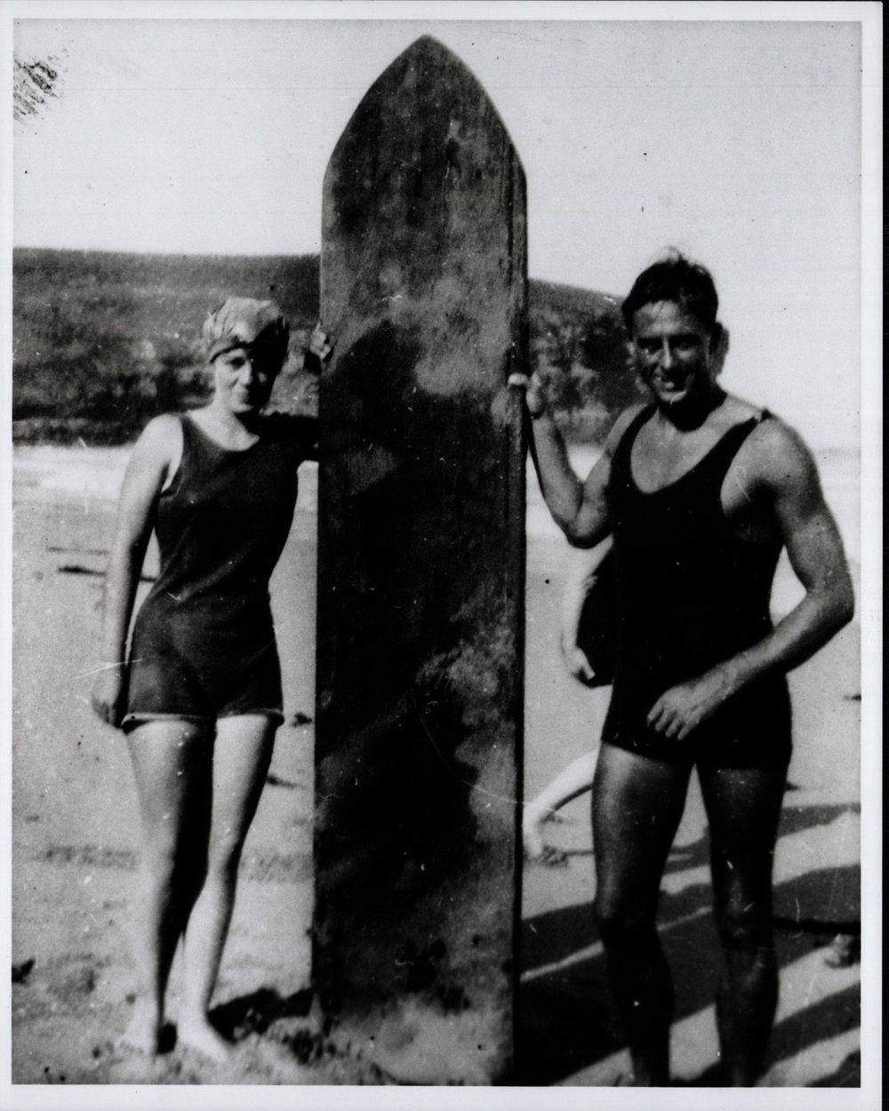 Isabel Letham and friend with surfboard at Bilgola Beach