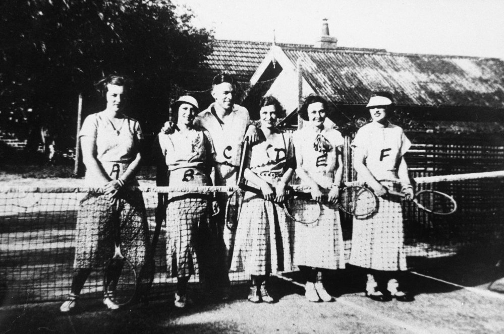 Weight family playing tennis, Dee Why
