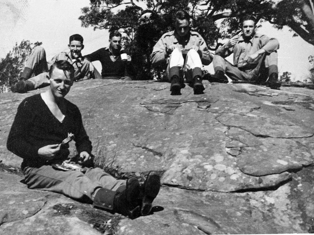 Soldiers eating their meal on rocks at West Head