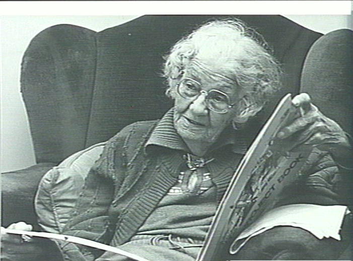 Isabel Letham, age 88, looking at her Scrap Book