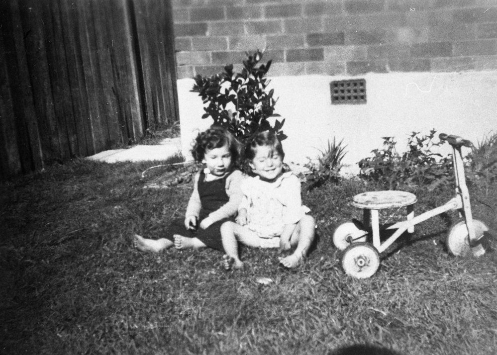 Raffo children playing in garden, 75 Wyuna Avenue, Harbord