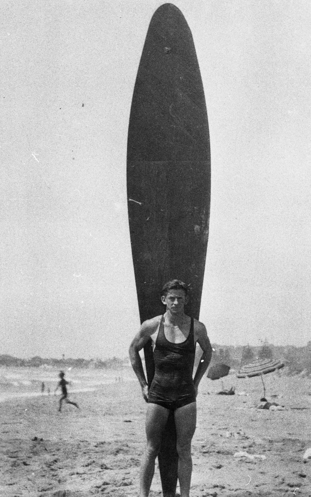 Sam Gray with surfboard, North Narrabeen Beach