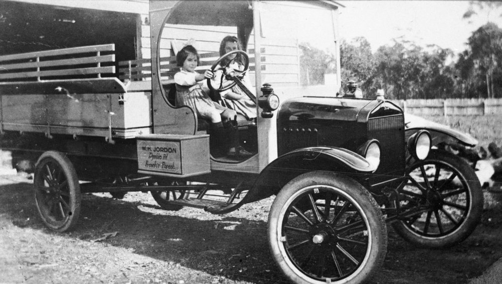 Little girls in W H Jordon fruit and vegetable truck, Brookvale