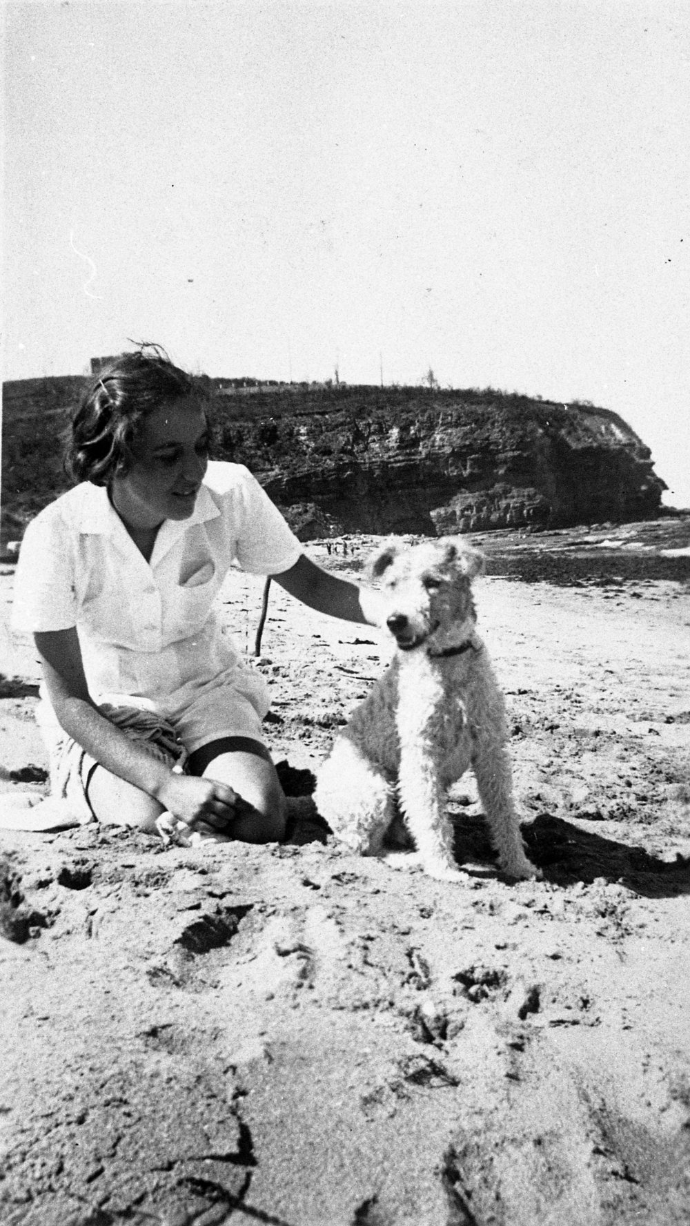 Betty Howes and dog Cluey on Bilgola Beach