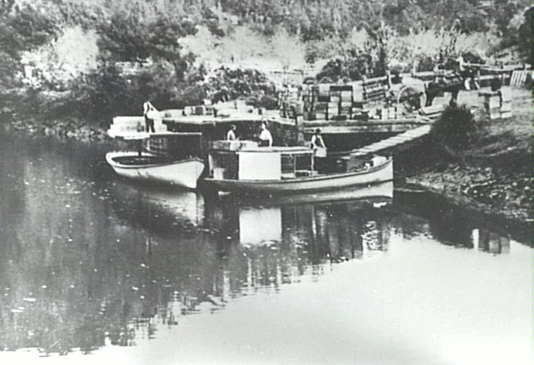 Loading cargo for market from wharf on the Hawkesbury River