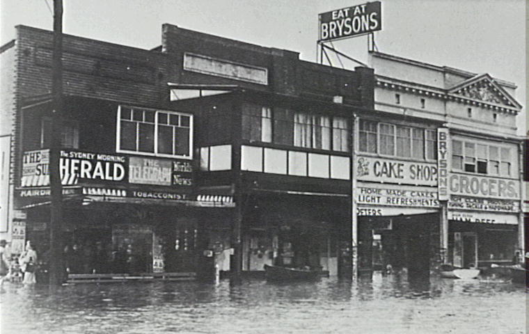 Brysons Cafe and shops during flood, Narrabeen, 1942