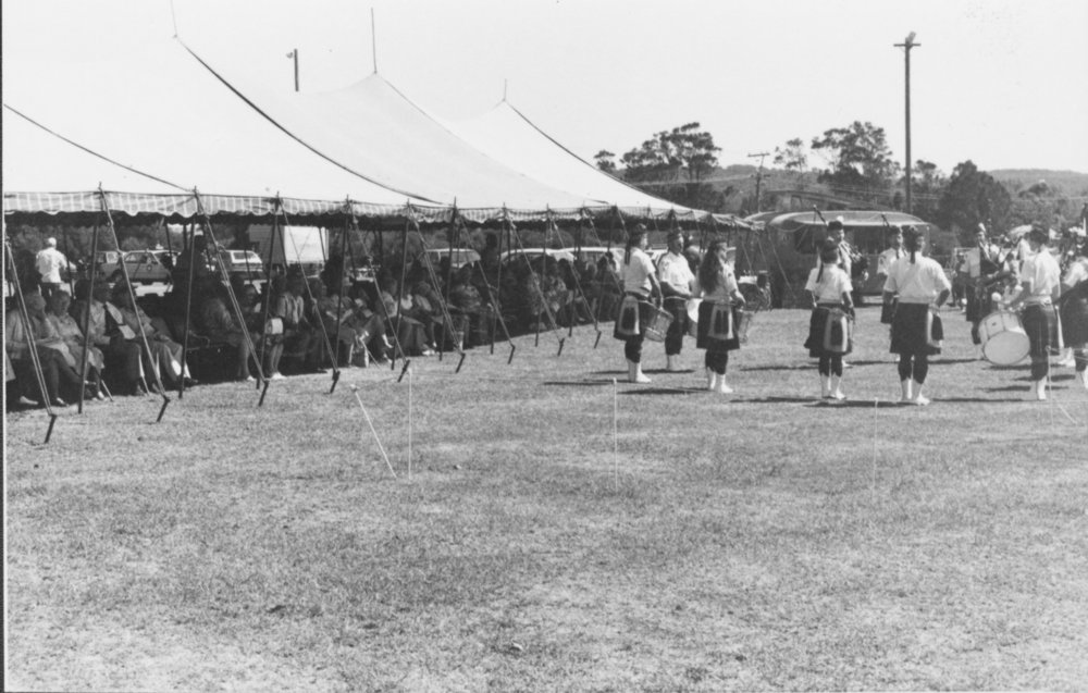 Manly Warringah Scottish band beside a marquee looking to Boondah Road ...