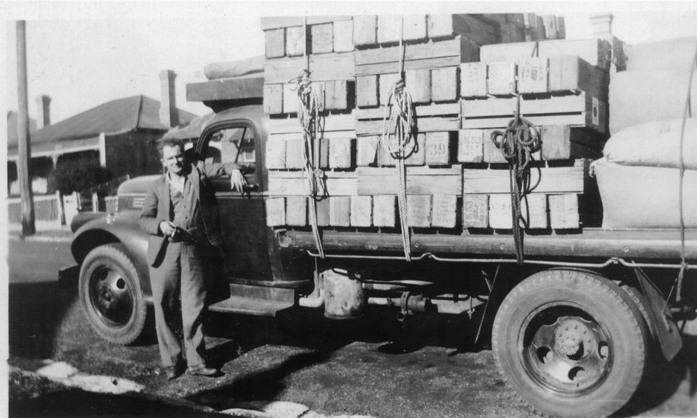 Matt Pecar with a delivery of tomatoes for the markets, Warriewood, 1950s