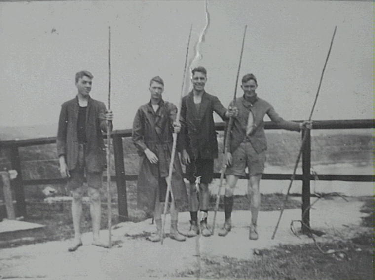 Ralph Semmler, Bob Yewen, Des Semmler and Stan Yewen standing at Bungan holding fishing rods. 