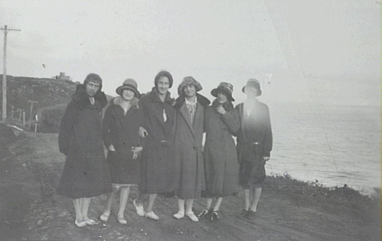 Group of people standing on Bungan Head Road dressed in warm clothing
