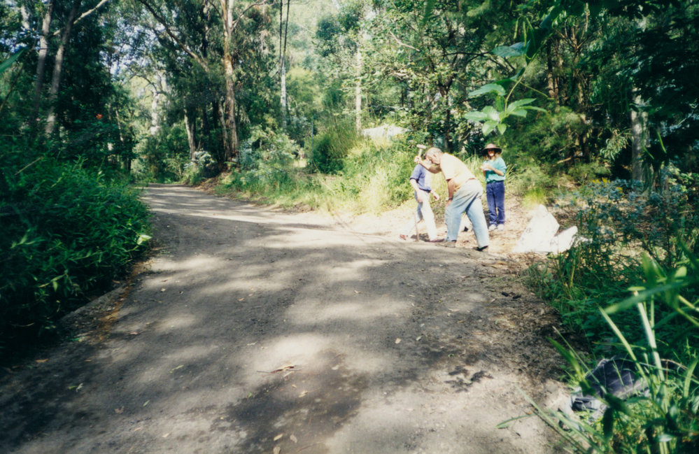 Initial work stabilising road surfaces using recycled bitumen, Scotland Island