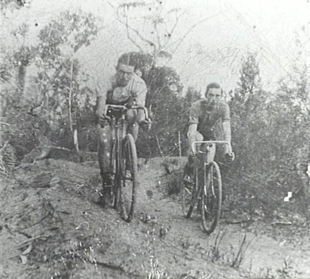 Bob (Robert) and Arthur Larkin riding bikes  on the Larkin farm at Ingleside
