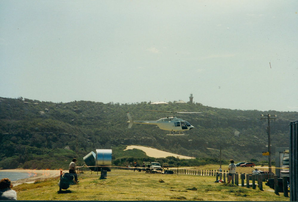 Helicopter delivering a water tank to palm Beach, 1995