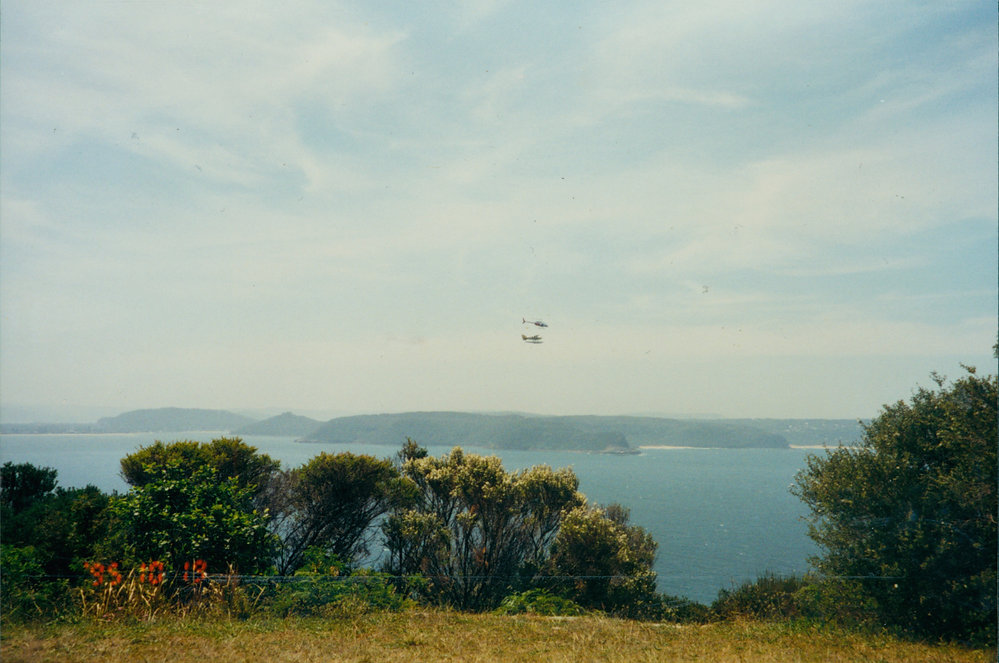 Helicopter and seaplane flying over Pittwater. 1995.