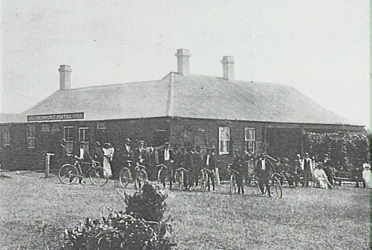 Group of bicycle riders outside the Newport Hotel, 1907